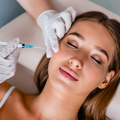 Relaxed woman receiving BOTOX in side of face