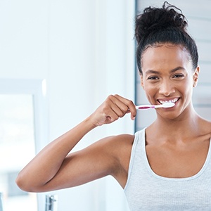 Woman brushing her teeth