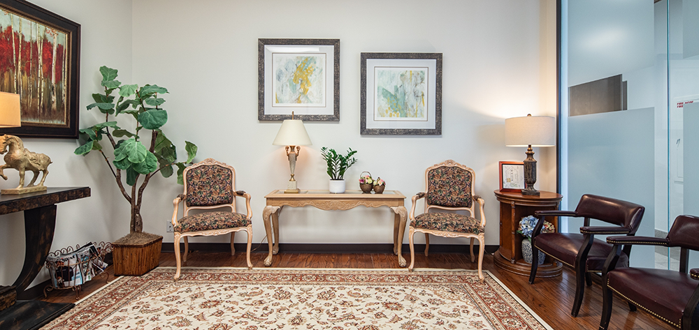 Dental waiting room with chairs and picture frames