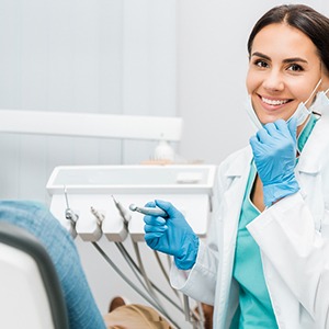 Dentist smiling at patient's dental exam